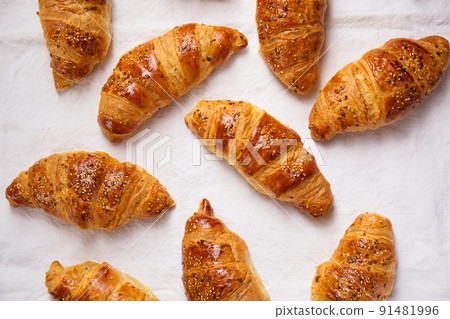ruddy croissants on a textured white fabric ruddy croissants on a textured white fabric 91481996