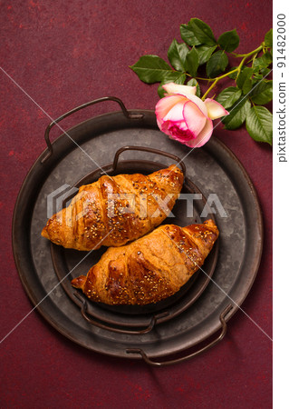 Two crispy croissants and a rose Two crispy croissants and a rose 91482000