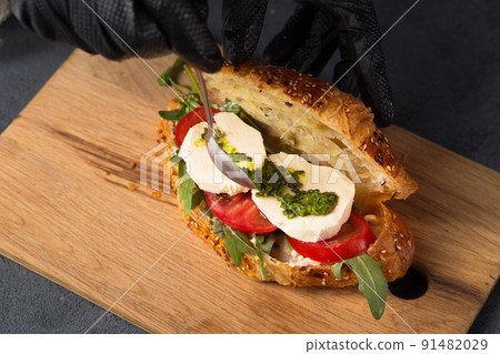Croissant with cheese and tomato 91482029