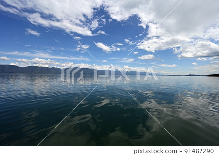 Beautiful dramatic summer cloudscape over Flathead Lake in Montana. 91482290