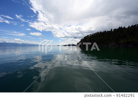 Beautiful dramatic summer cloudscape over Flathead Lake in Montana. Beautiful dramatic summer cloudscape over Flathead Lake in Montana. 91482291
