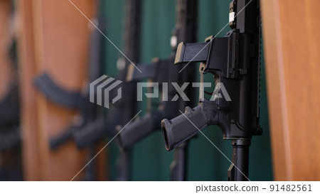 Rifles or air rifles on a rack are for sale Rifles or air rifles on a rack are for sale 91482561