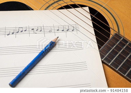 Music recording scene with guitar pencil and note sheet 91484158