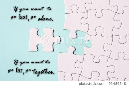 Motivational quote and white jigsaw puzzle with some missing pieces. Motivational quote and white jigsaw puzzle with some missing pieces. 91484848
