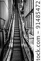 black and white image of a modern escalator in shanghai 91485472