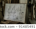 Old sailboat, compass and ancient map historical background. A concept on the topic of sea voyages, discoveries, pirates, sailors and history. 91485491