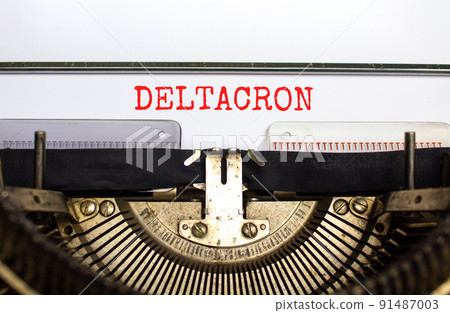 Covid-19 corona deltacron symbol. The concept word Deltacron typed on retro typewriter. Beautiful white background. Medical, covid-19 corona deltacron variant concept. Copy space. 91487003