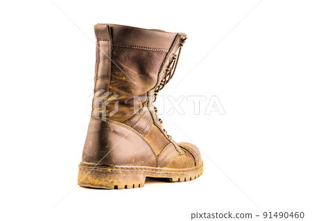 dirty military style light ankle boot isolated on white background dirty military style light ankle boot isolated on white background 91490460