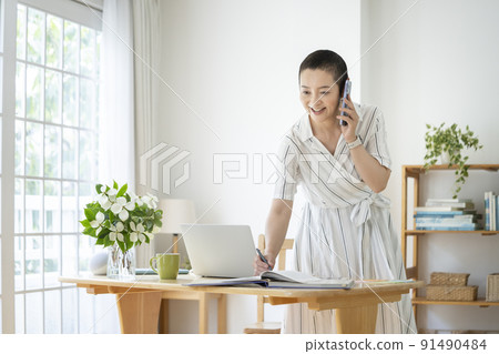 Image of middle-aged women working from home Image of middle-aged women working from home 91490484
