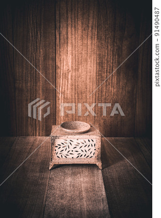 Censer and vintage wood background Censer and vintage wood background 91490487