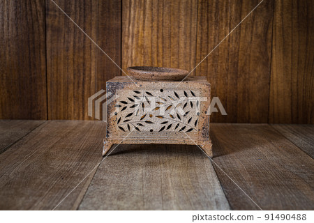 Censer and vintage wood background Censer and vintage wood background 91490488