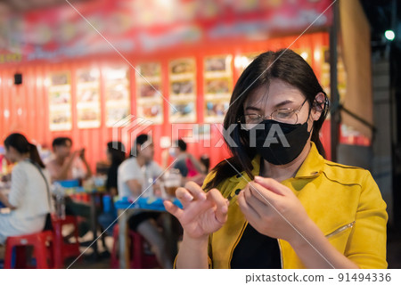 Woman (LGBTQ) posing with food at thai street food 91494336