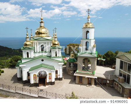 Christian church in the mountains above the sea. Temple of the Holy Archangel Michael in Oreanda. The southern coast of Crimea. Aerial view 91496091