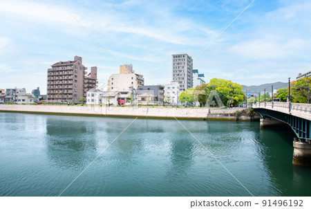 We are looking toward Nishi-Hiroshima Station and Kanonmachi from the Midori Ohashi Bridge on Peace Boulevard. Please enjoy the bright cityscape. Hiroshima We are looking toward Nishi-Hiroshima Station and Kanonmachi from the Midori Ohashi Bridge on Peace Boulevard. Please enjoy the bright cityscape. Hiroshima 91496192