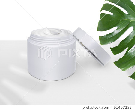 Luxury skin care product ad, of Cosmetic cream with monstera leaf 91497255