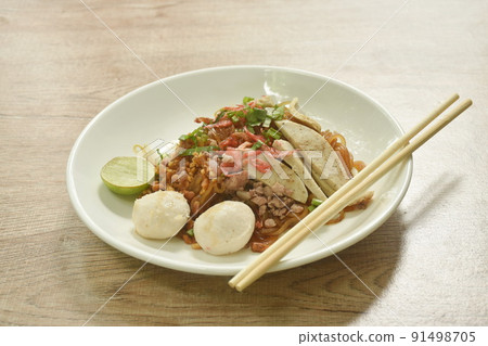 stir fried thin rice noodle with pork meatball dressing dry shrimp in black sweet soy sauce on plate stir fried thin rice noodle with pork meatball dressing dry shrimp in black sweet soy sauce on plate 91498705