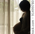 Maternity photo of a pregnant woman who has reached the end of the month (10 months pregnant) 91499780