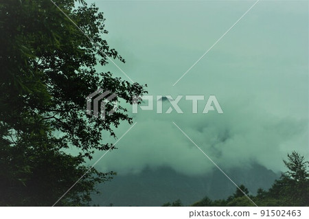 A mountain covered with clouds A mountain covered with clouds 91502463