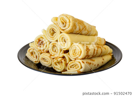 Crepes on a black plate. Isolate on a white background. 91502470