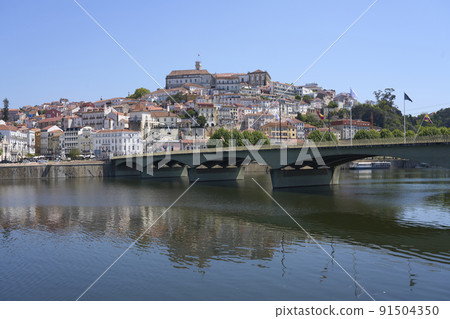 Coimbra city and Santa Clara bridge over Mondego river in Portugal Coimbra city and Santa Clara bridge over Mondego river in Portugal 91504350