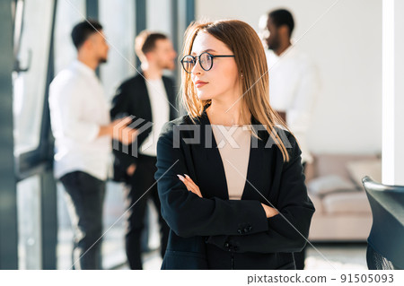Young office worker and her colleagues in the background 91505093