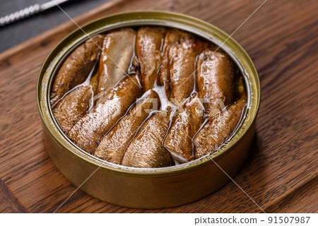 Delicious fresh sandwich with sprats with crispy toast, butter and cucumber Delicious fresh sandwich with sprats with crispy toast, butter and cucumber 91507987