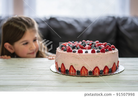 Little girl birthday cake.Home made cake with berries. Cake with Strawberry, blackberry, blueberry, and raspberry on a table Little girl birthday cake.Home made cake with berries. Cake with Strawberry, blackberry, blueberry, and raspberry on a table 91507998