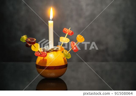 Orange Christingle is a symbolic object used in the Advent, Christmas and Epiphany services of many Christian denominations Orange Christingle is a symbolic object used in the Advent, Christmas and Epiphany services of many Christian denominations 91508064