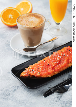 Traditional Spanish breakfast. Tostada with different toppings on a light background Traditional Spanish breakfast. Tostada with different toppings on a light background 91509622