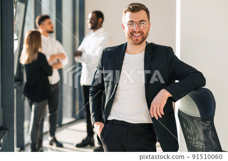 Portrait of handsome man with beard and jacket in the office 91510060