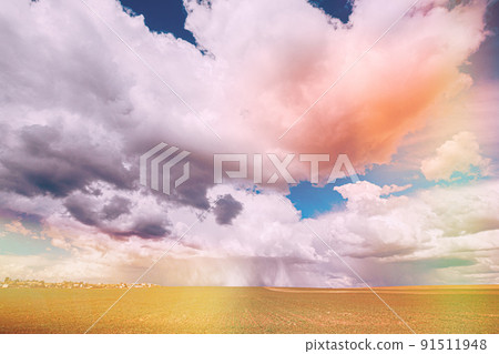 Sky During Rain Horizon Above Rural Wheat Landscape Field. Agricultural And Weather Forecast Concept. Storm, Thunder, thunderstorm, stormclouds. Rainy Day, stormclouds Sky During Rain Horizon Rain 91511948