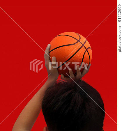 Hands and basketball isolated on red background Hands and basketball isolated on red background 91512609
