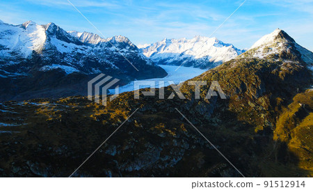 Aerial view over the largest glacier in Europe - the Aletschgletscher in the Swiss Alps Aerial view over the largest glacier in Europe - the Aletschgletscher in the Swiss Alps 91512914