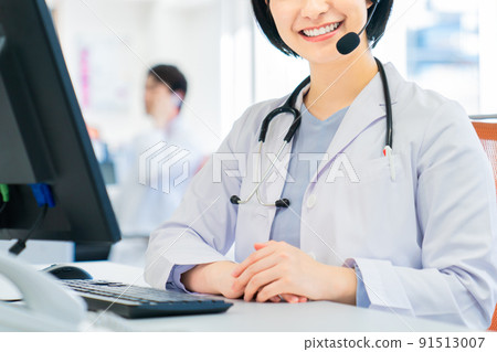Young female doctor doing online medical treatment Young female doctor doing online medical treatment 91513007