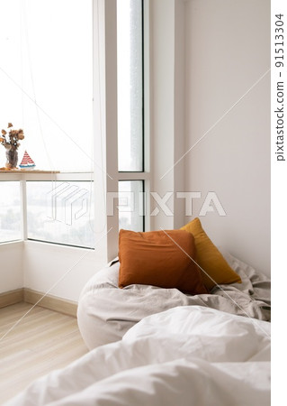 Relaxed bean bag sofa in the living room apartment with windows. Relaxed bean bag sofa in the living room apartment with windows. 91513304