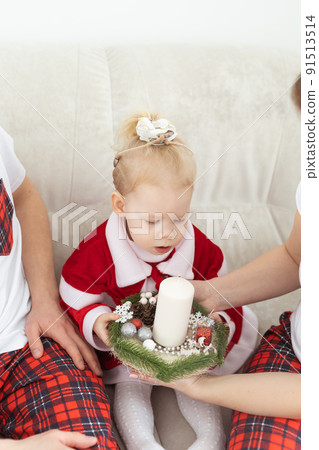 Child with cochlear implant hearing aid having fun with parents in christmas living room - diversity , deafness treatment and medical innovative technologies 91513514