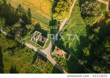 Aerial View Remains Of Yastrzhembsky Estate And Park Complex. Top View Of Old Five-storey Brick Water Tower. Drone View Of Beautiful European Nature From High Attitude In Summer Season. Bird's Eye Aerial View Remains Of Yastrzhembsky Estate And Park Complex. Top View Of Old Five-storey Brick Water Tower. Drone View Of Beautiful European Nature From High Attitude In Summer Season. Bird's Eye 91513632