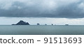 Rainstorms are forming under the clouds in the middle of the sea approaching the coast, a mysterious and fear natural phenomenon. Thailand. 91513693