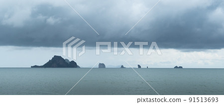 Rainstorms are forming under the clouds in the middle of the sea approaching the coast, a mysterious and fear natural phenomenon. Thailand. 91513693
