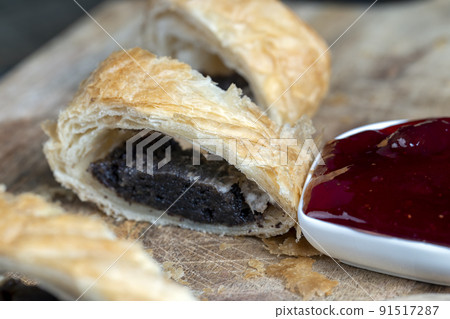 puff pastry bun made of wheat dough and poppy seed filling puff pastry bun made of wheat dough and poppy seed filling 91517287