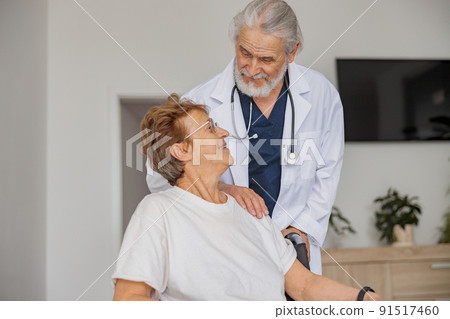 Doctor supporting a sick patient before medical procedures in a hospital room 91517460