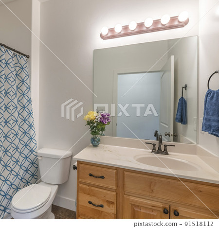 Square frame Bathroom with wooden vanity sink with flower vase and mirror 91518112