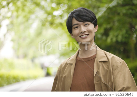 Male in his 20s Portrait in the fresh green 91520645