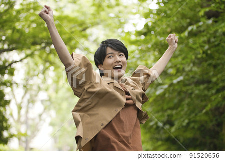 Male in his 20s Portrait in the fresh green Male in his 20s Portrait in the fresh green 91520656