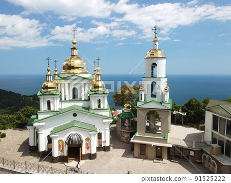 Christian church in the mountains above the sea. Temple of the Holy Archangel Michael in Oreanda. The southern coast of Crimea. Aerial view 91525222