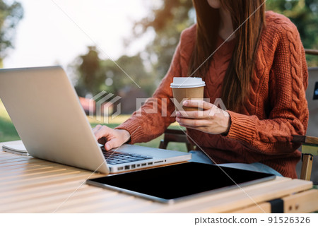 Business people working in the work area with laptop and tablet at the desk. business concepts, area outdoor. Business people working in the work area with laptop and tablet at the desk. business concepts, area outdoor. 91526326