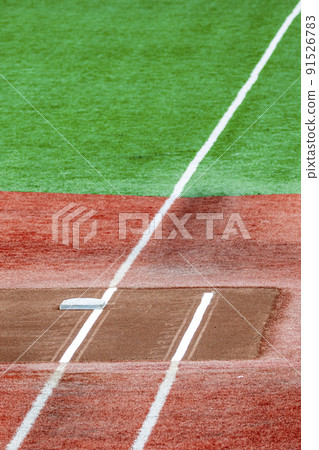 White line near the first base of the baseball field 91526783