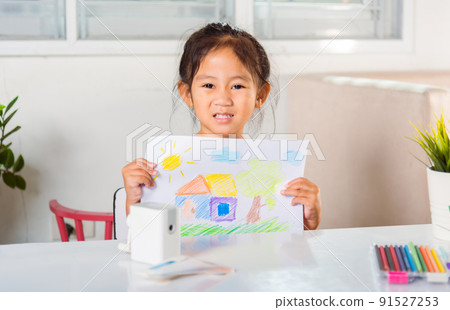little girl lift up colorful drawing landscape my home dream on paper to camera 91527253