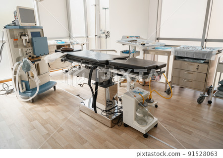Interior of operation room with different medical equipment ready for surgery Interior of operation room with different medical equipment ready for surgery 91528063