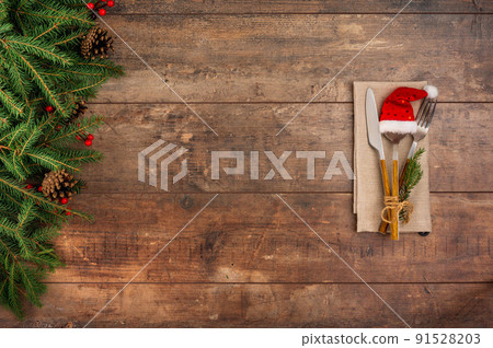 Authentic Christmas Table Setting. Silverware, Fir tree, Top view with copy space for text. Christmas table place setting. Winter holidays background. Authentic Christmas Table Setting. Silverware, Fir tree, Top view with copy space for text. Christmas table place setting. Winter holidays background. 91528203